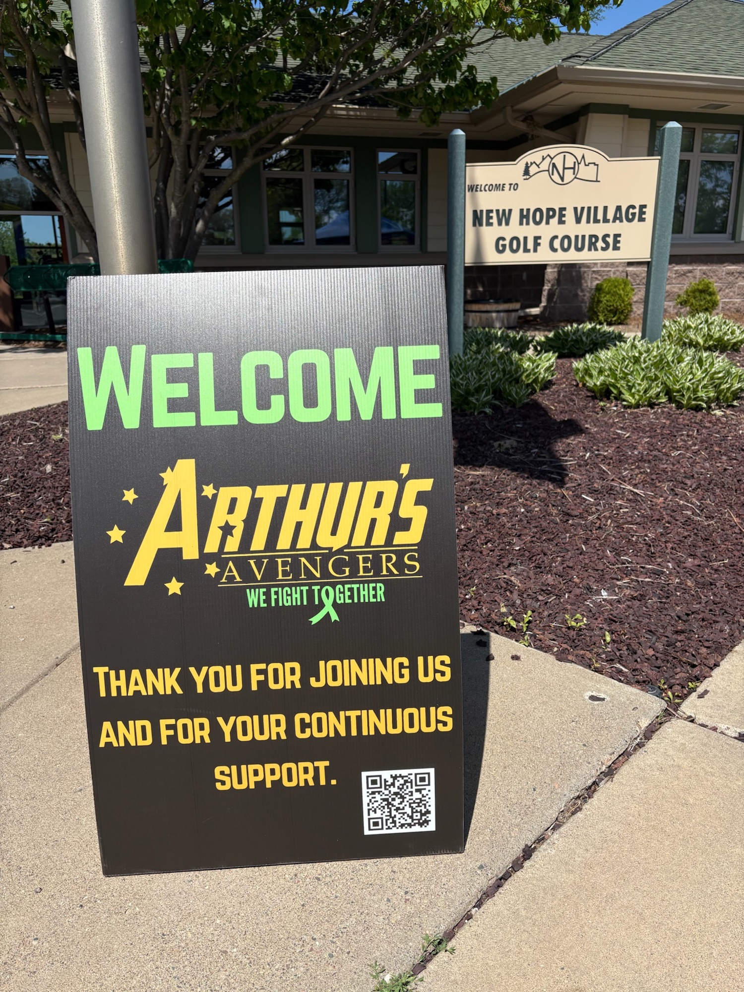 Welcome sign for the Swing for Childhood Cancer golf tournament at New Hope Village Golf Course